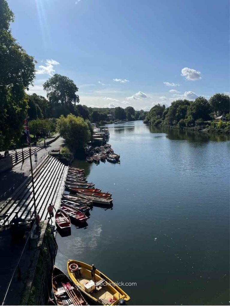 Richmond Bridge over the River Thames with boats and riverside scenery