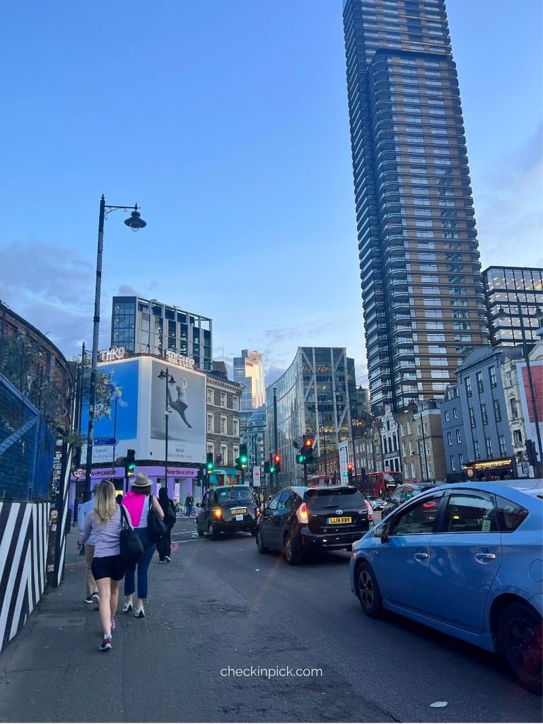 Cars and pedestrians on a street in Shoreditch, London