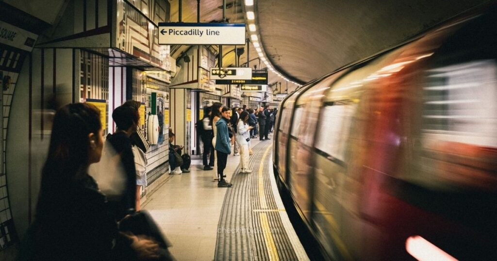 Passengers waiting for a train at a London Underground station platform