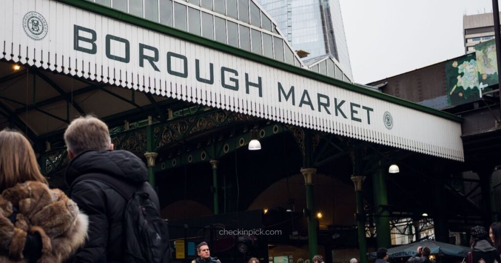 Visitors enjoying food stalls inside Borough Market.
