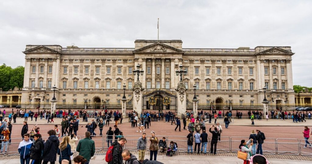 Visitors gathering outside Buckingham Palace in London.