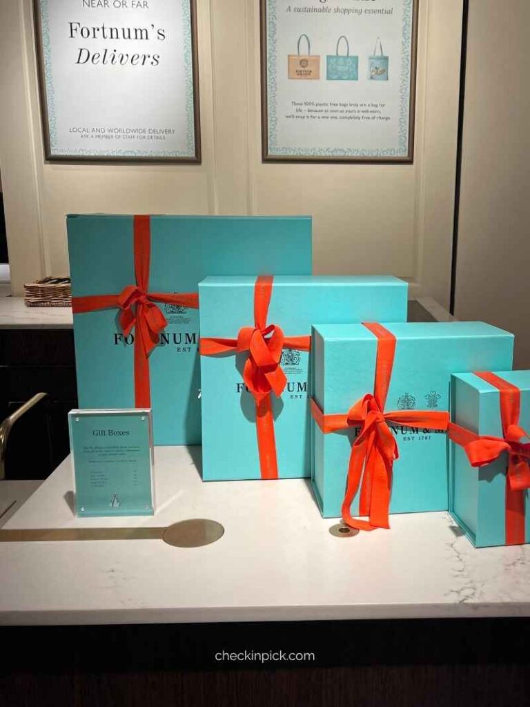 Signature Eau de Nil gift boxes with orange ribbons at Fortnum & Mason London