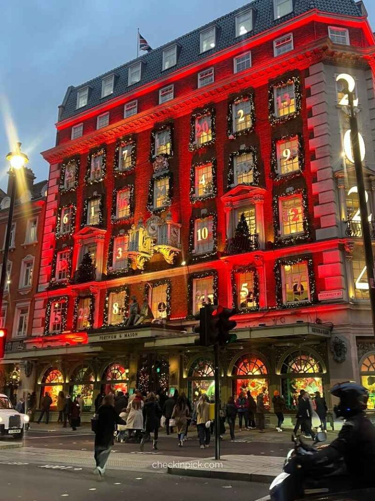 The illuminated exterior of the Fortnum & Mason store in London for What to Buy at Fortnum and Mason London