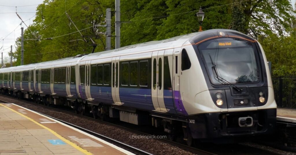 How to use the Elizabeth Line in London featuring full view of purple-branded Elizabeth Line train at platform