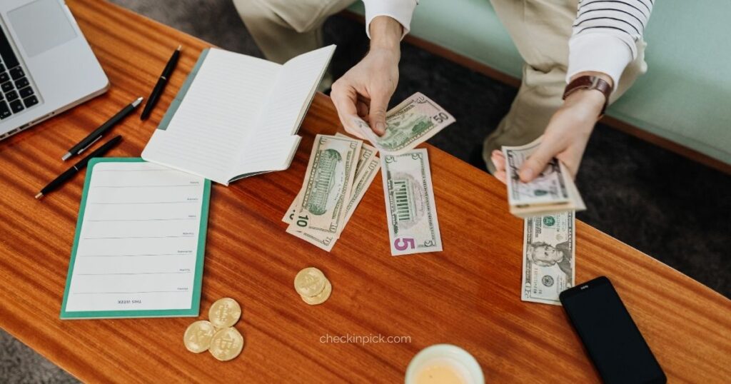 Traveler planning a London trip with a notebook, and travel budget.