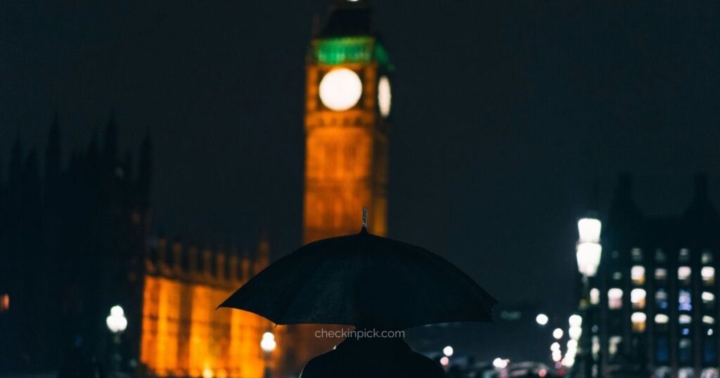 Tourist prepared for London's changing weather near Westminster