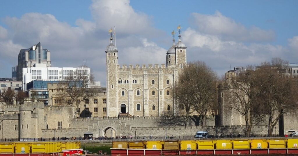 Visitors exploring the historic Tower of London on a sunny day